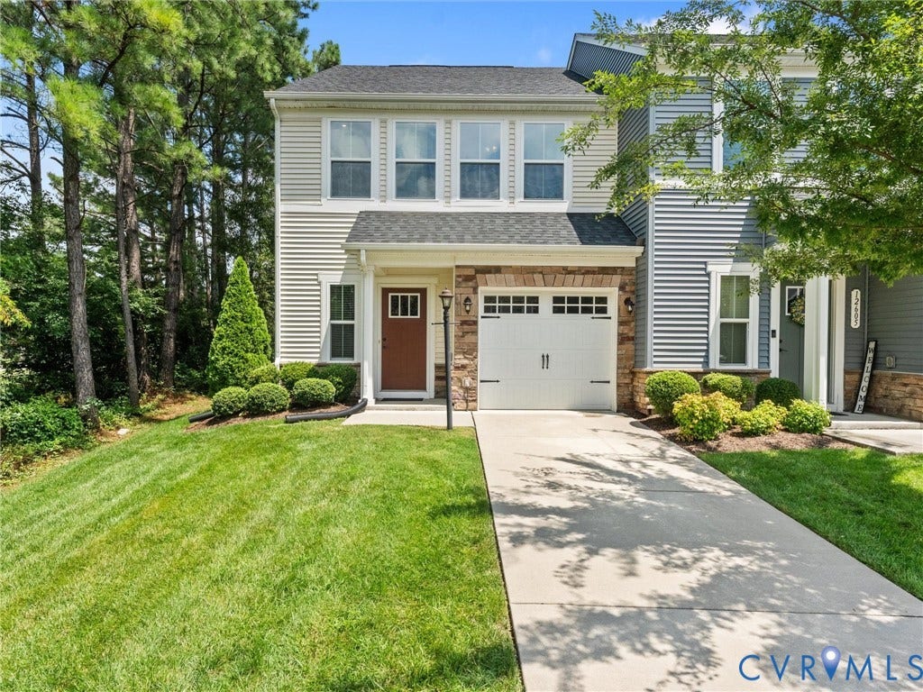 12601 Prestonfield Drive, Blalock, Chesterfield, VA 23836 Two-story residence featuring light-colored siding, a stone facade, and an attached garage with a white door