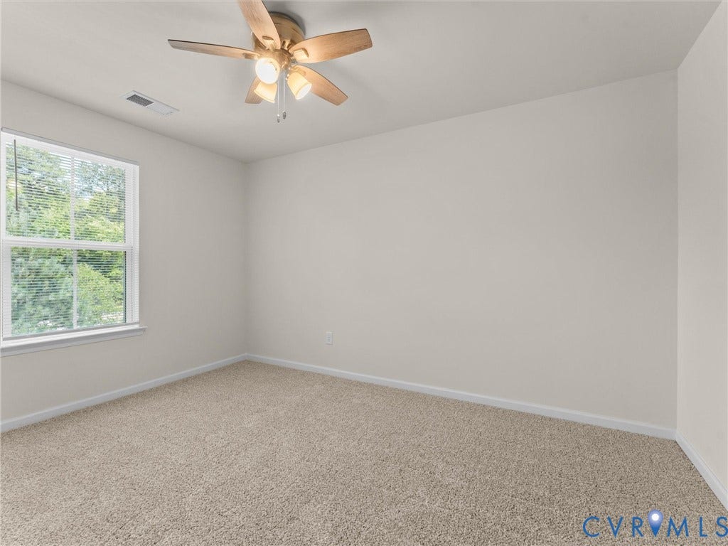 12601 Prestonfield Drive, Blalock, Chesterfield, VA 23836 Neutral wall tones, plush carpeting, ceiling fan with integrated lighting, and a double-pane window