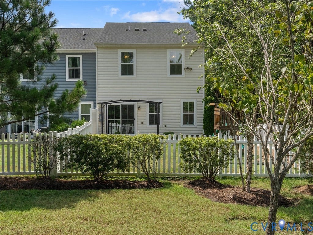 12601 Prestonfield Drive, Blalock, Chesterfield, VA 23836 Rear exterior featuring light-colored siding, a covered patio area, and white window frames
