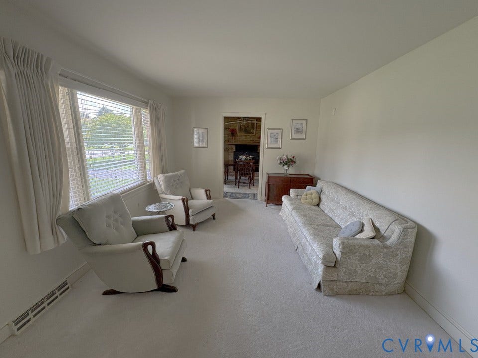 1004 Wilaka Lane, Richmond, VA 23227 Dining Room with brick fireplace with wood stove.