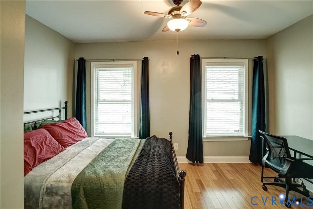 1410 W Clay Street, Richmond, VA 23220 Bedroom with multiple windows, light wood-style flooring, a ceiling fan, and a desk