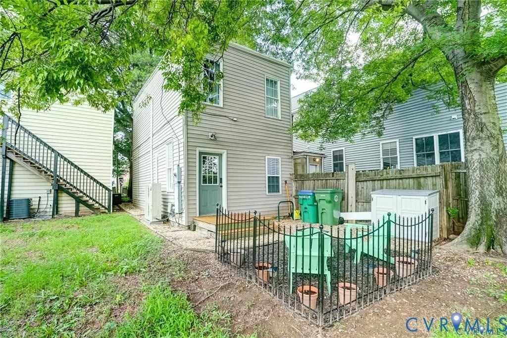 1410 W Clay Street, Richmond, VA 23220 Back of property with a patio and stairway