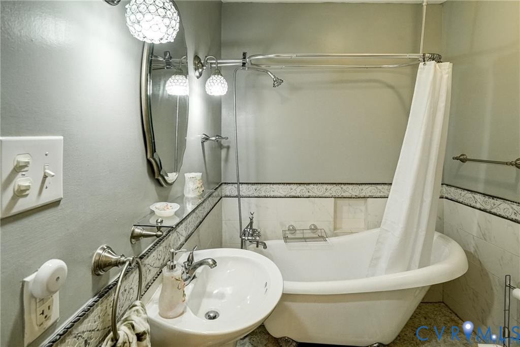 1410 W Clay Street, Richmond, VA 23220 Full bathroom featuring shower / bathtub combination with curtain and tile walls