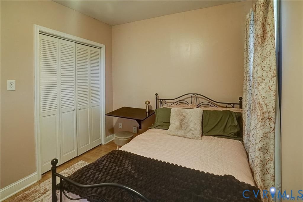 1410 W Clay Street, Richmond, VA 23220 Bedroom with light wood-style flooring and a closet