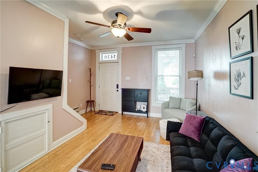 1410 W Clay Street, Richmond, VA 23220 Living room with light wood-type flooring, ornamental molding, and ceiling fan