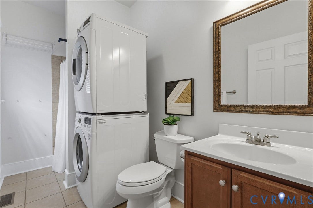 First floor full bathroom (shower, tile floor), plus washer and dryer that convey.