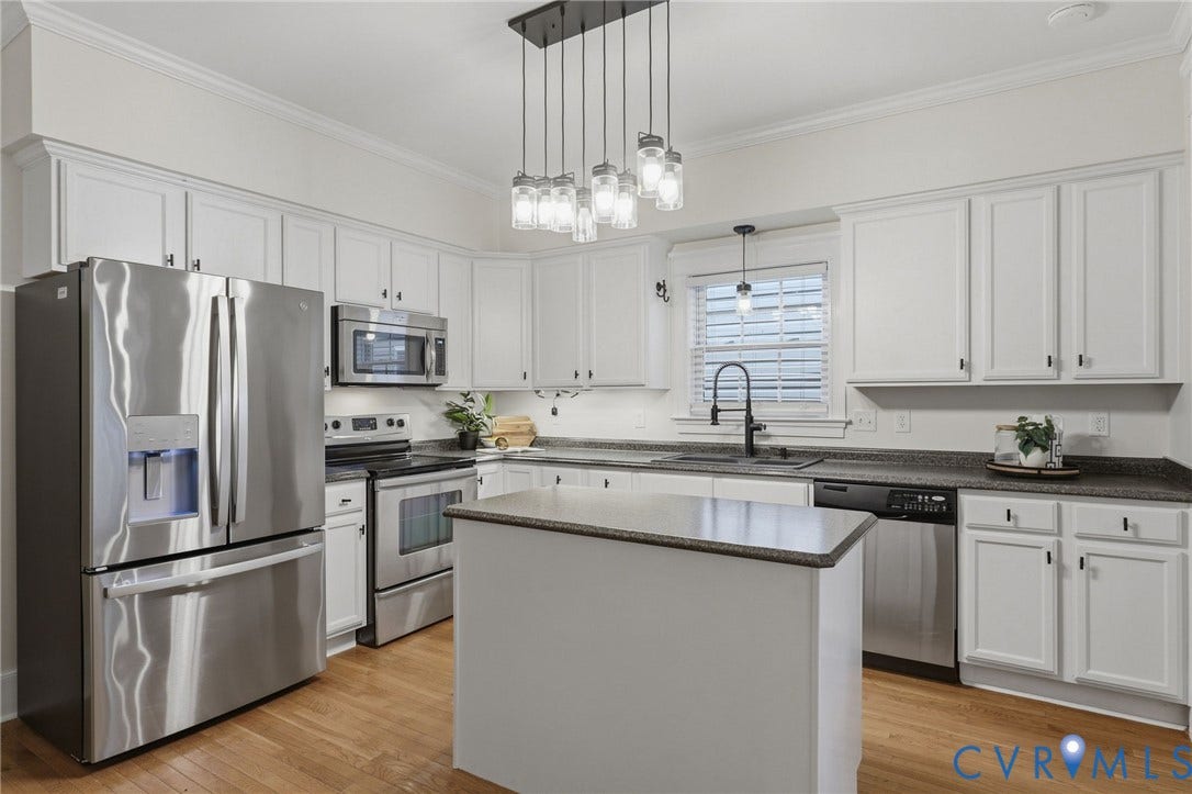 Oak hardwood floors, upgraded fixtures, Whirlpool appliances.