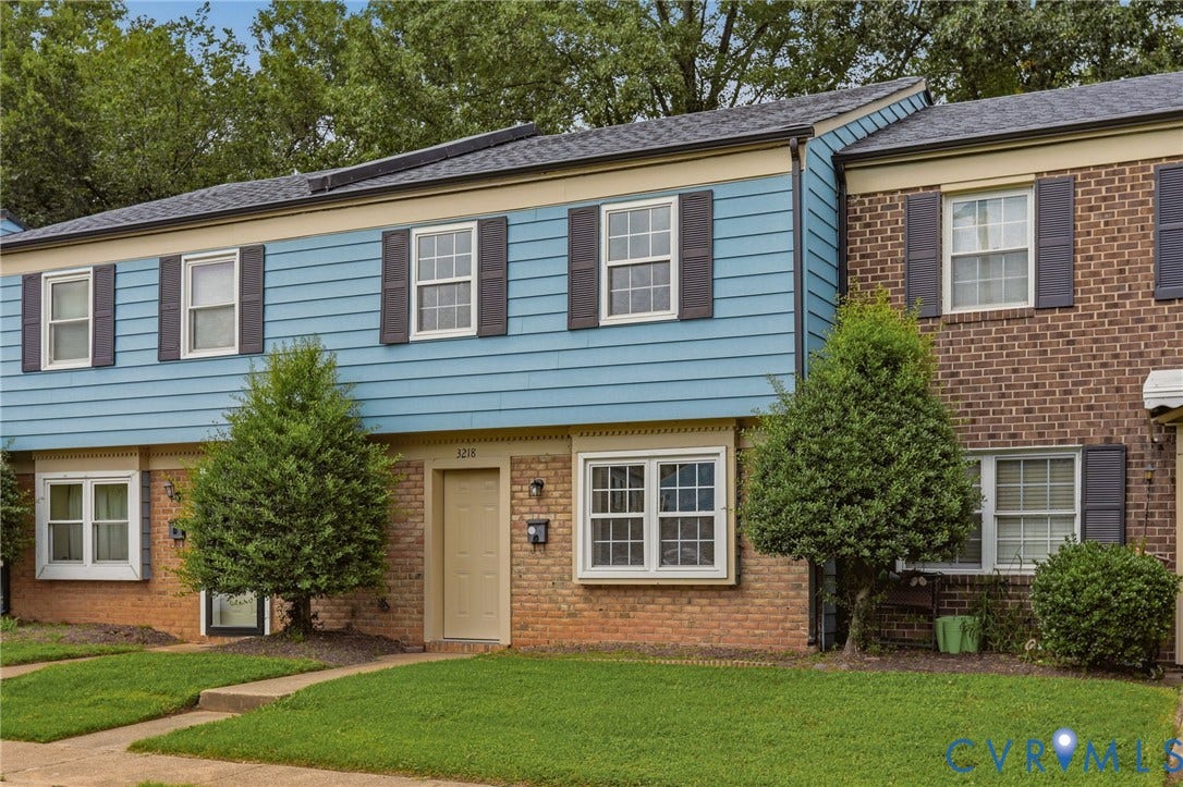 3218 Hunters Mill Court, Henrico, VA 23223 Two-story residence featuring brick and horizontal siding, dark shutters, and a front entry door with transom window