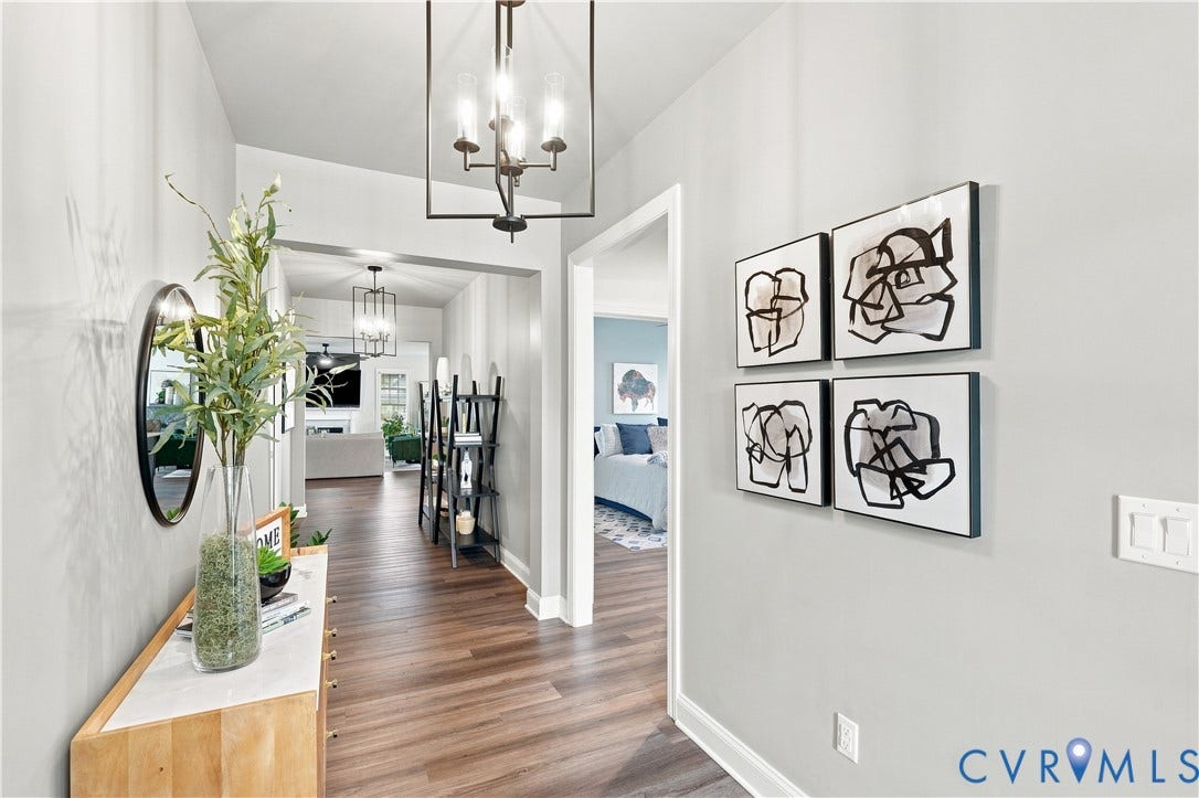 7437 Aldeby Street, Glen Allen, VA 23059 Recessed entry with wood-finish flooring, white trim, and a contemporary ceiling light fixture