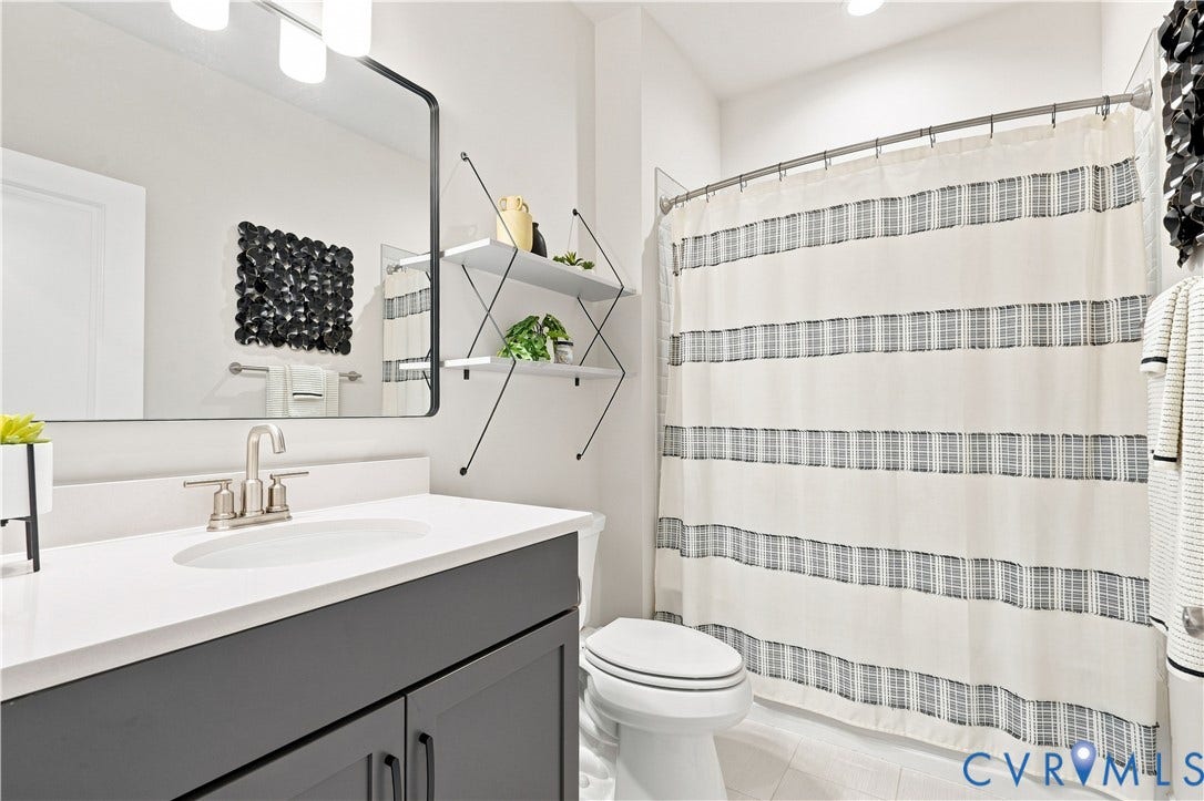 7437 Aldeby Street, Glen Allen, VA 23059 Vanity with white countertop, undermount sink, and brushed nickel faucet