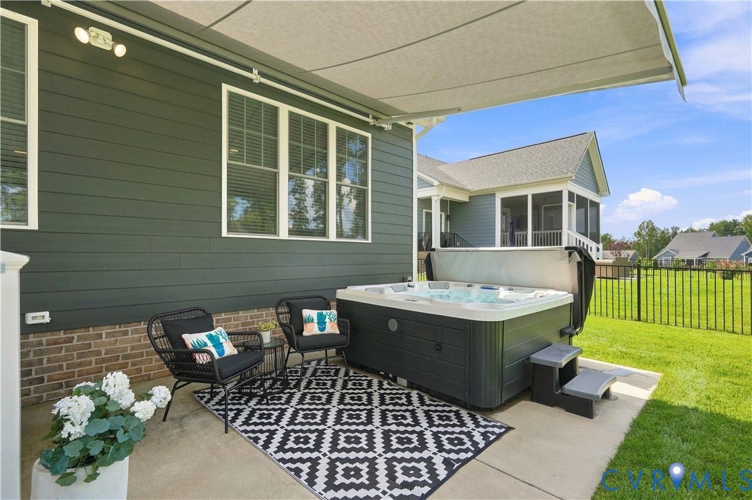 7437 Aldeby Street, Glen Allen, VA 23059 Patio featuring a built-in hot tub, retractable awning, and a screened porch