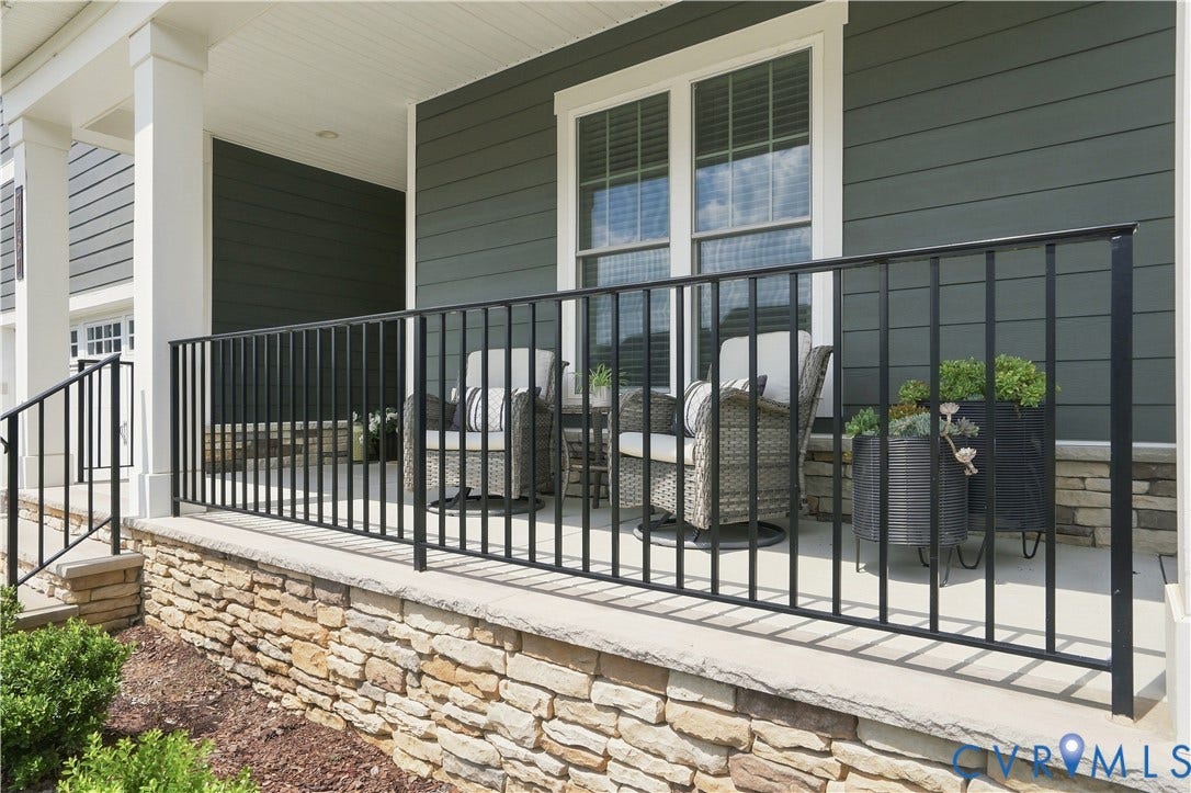 7437 Aldeby Street, Glen Allen, VA 23059 A covered porch, white columns, and wrought-iron railings