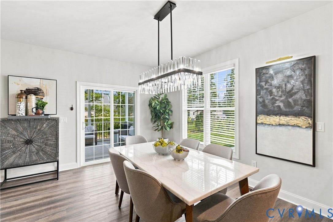 7437 Aldeby Street, Glen Allen, VA 23059 Wood-finish flooring, white walls, and a rectangular crystal chandelier