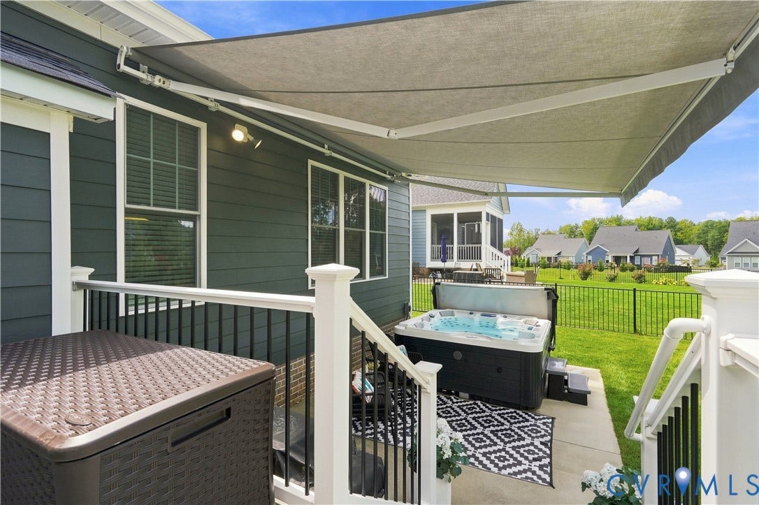 7437 Aldeby Street, Glen Allen, VA 23059 Patio featuring a hot tub/spa, concrete flooring, and a partial brick exterior