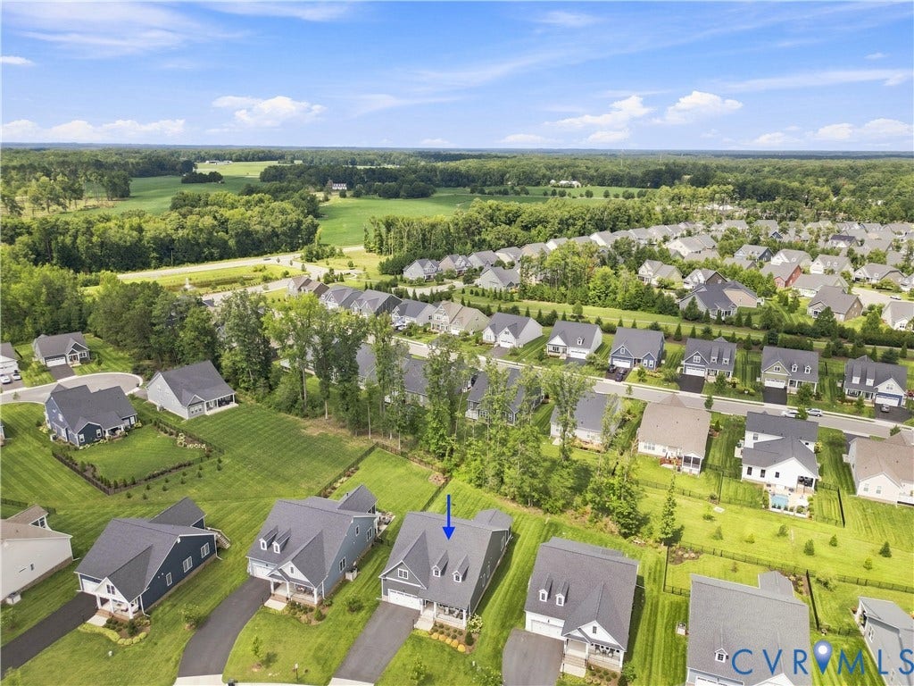 7437 Aldeby Street, Glen Allen, VA 23059 Aerial perspective showcasing a residential community with abundant green spaces and extensive tree coverage