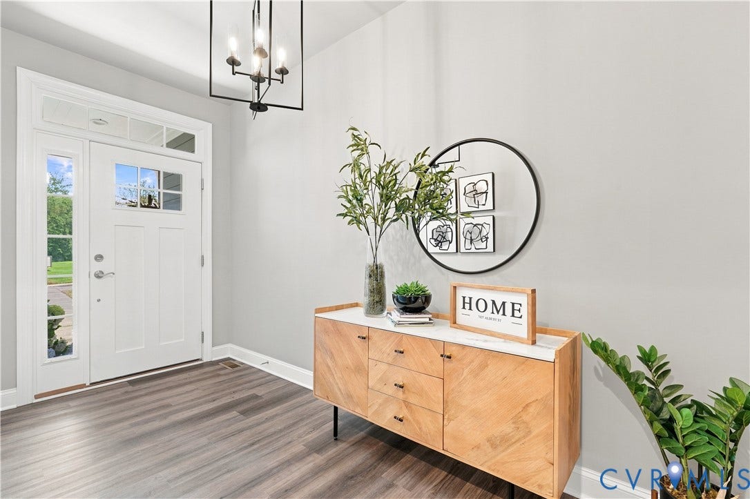 7437 Aldeby Street, Glen Allen, VA 23059 Entryway featuring a decorative transom and sidelight, wood-finish flooring, and a modern chandelier