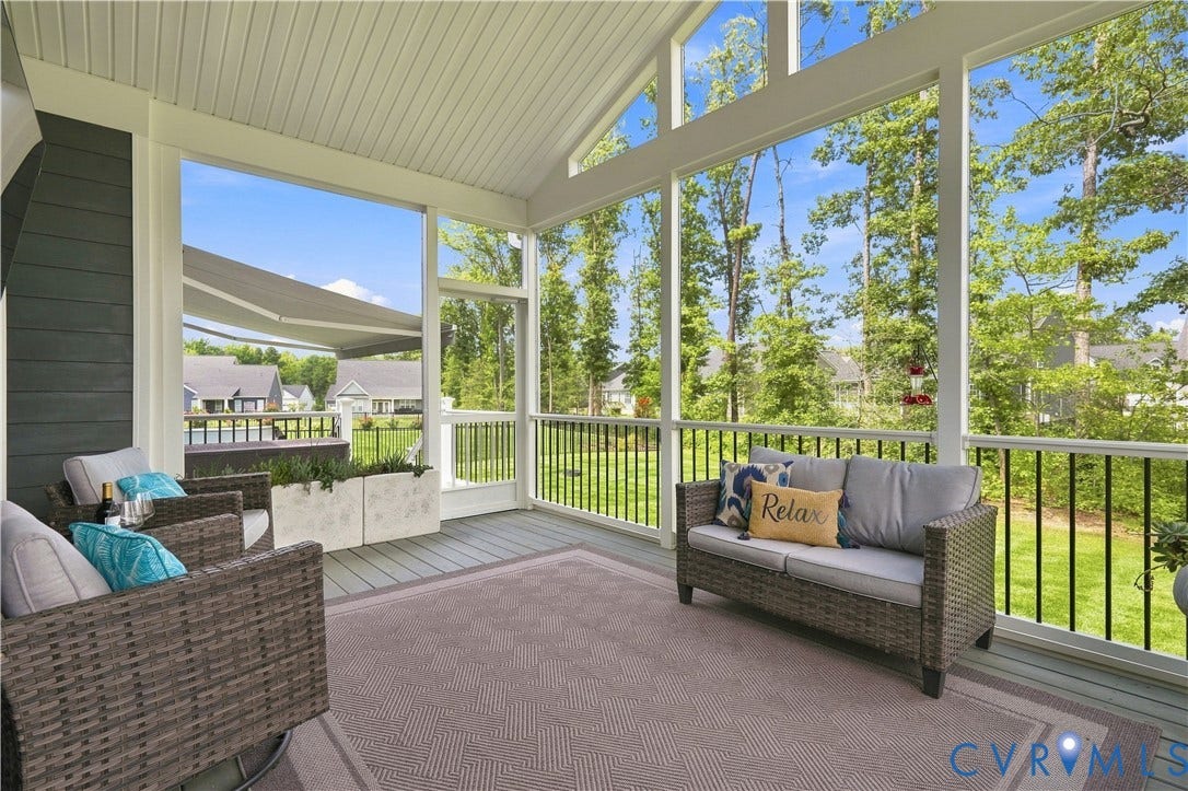 7437 Aldeby Street, Glen Allen, VA 23059 Vaulted screened porch featuring a slatted ceiling, dark gray siding, and a wooden deck