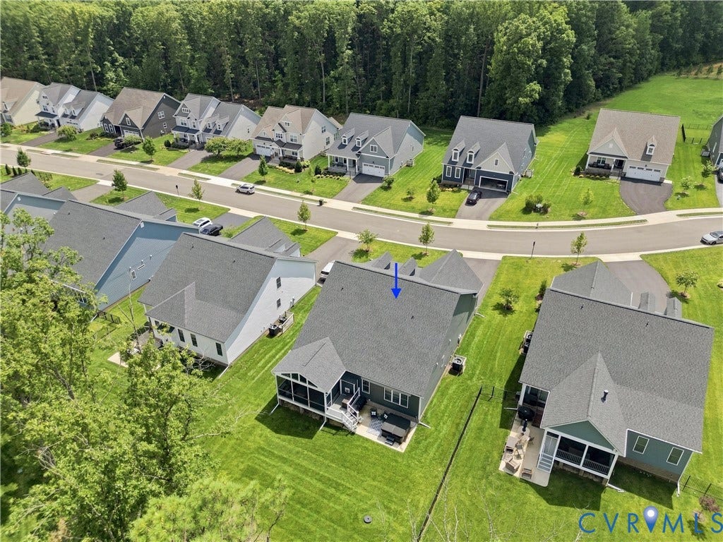 7437 Aldeby Street, Glen Allen, VA 23059 Aerial perspective showcasing a residential community with abundant green spaces and extensive tree coverage