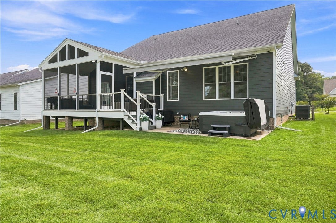 7437 Aldeby Street, Glen Allen, VA 23059 Screened porch with white railings, elevated patio, and a spa / hot-tub area