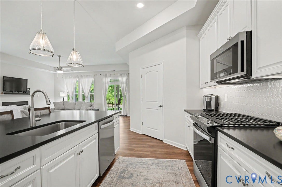 11618 Orchard Falls Circle, Chickahominy Falls, Glen Allen, VA 23059 Kitchen featuring white cabinetry, dark countertops, stainless steel appliances, and wood-finish flooring