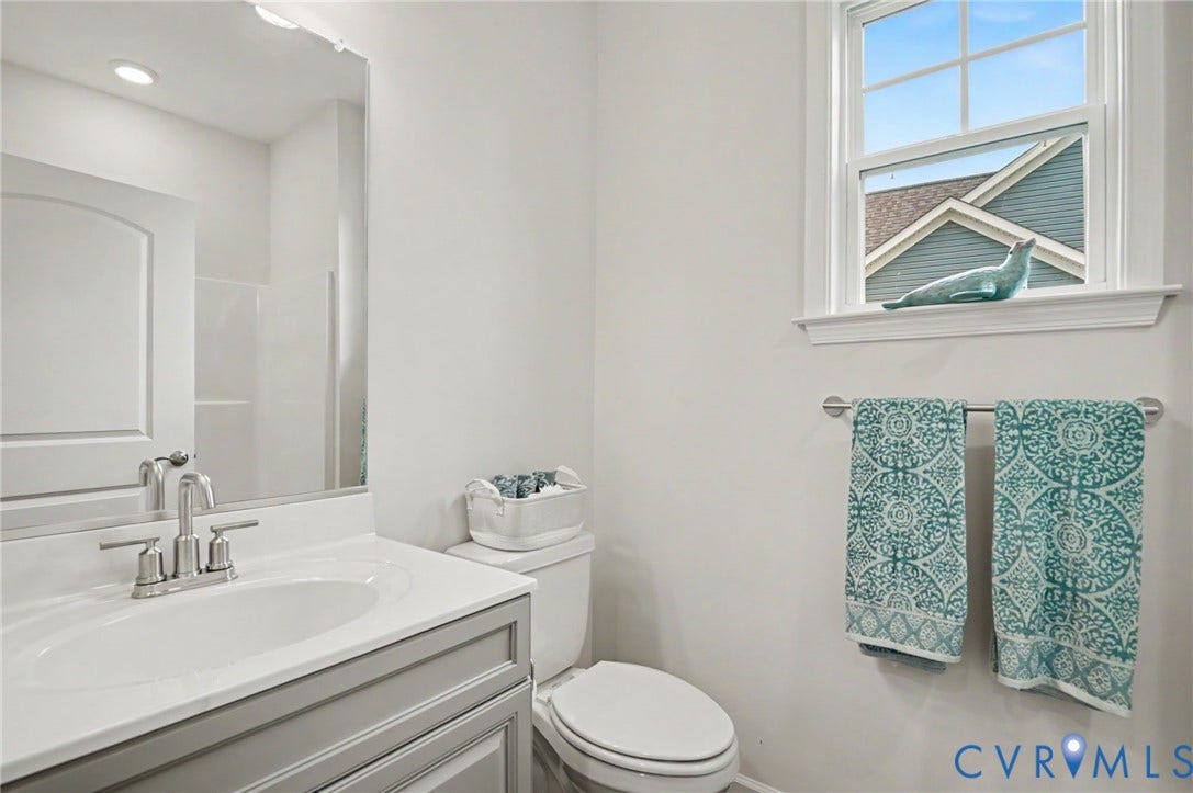 11618 Orchard Falls Circle, Chickahominy Falls, Glen Allen, VA 23059 Recessed lighting, single vanity with a light gray cabinet, white countertop, and polished chrome faucet