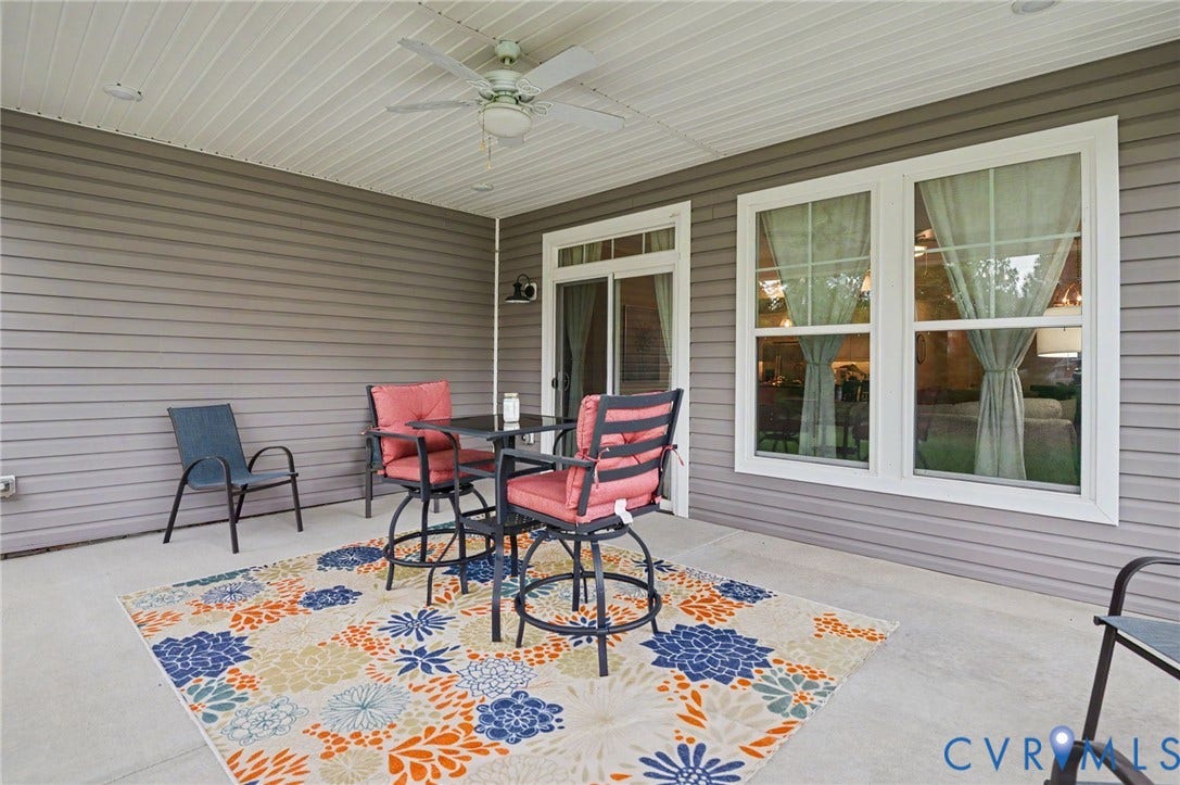 11618 Orchard Falls Circle, Chickahominy Falls, Glen Allen, VA 23059 Covered patio with a ceiling fan, concrete flooring, sliding glass door, and two large windows