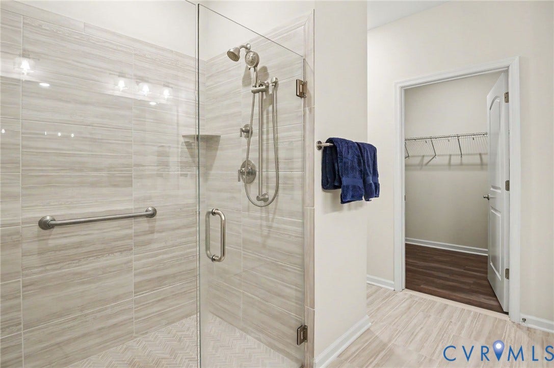 11618 Orchard Falls Circle, Chickahominy Falls, Glen Allen, VA 23059 Spacious shower with glass enclosure, vertical tile surround, and brushed nickel fixtures
