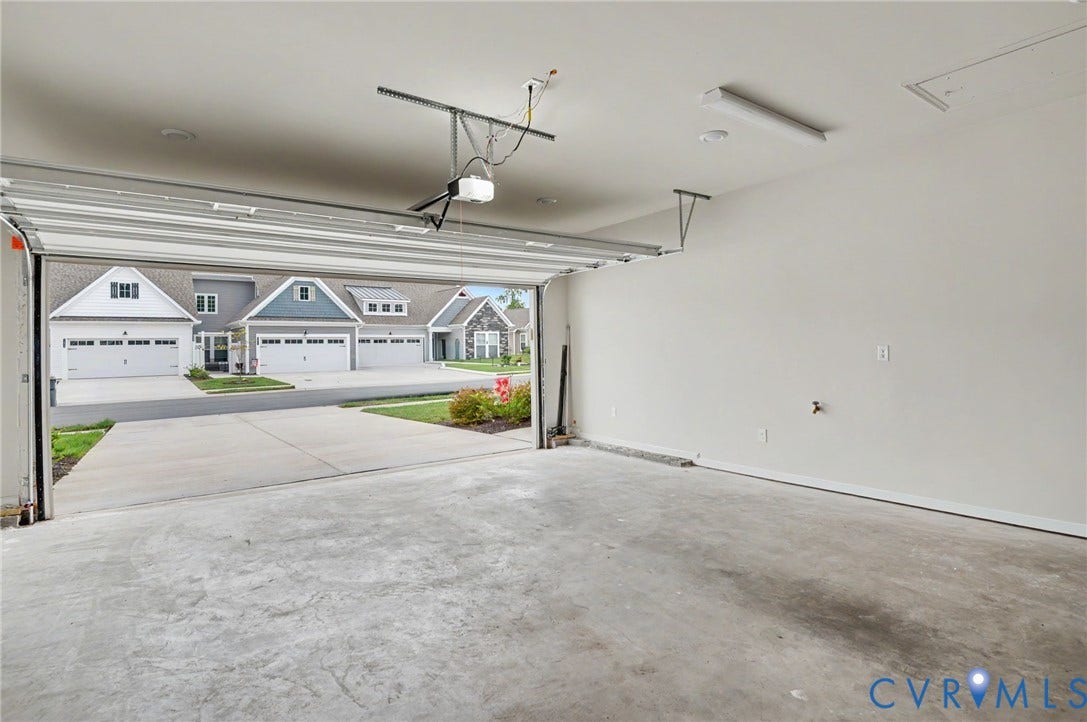 11618 Orchard Falls Circle, Chickahominy Falls, Glen Allen, VA 23059 Attached garage with concrete flooring, overhead lighting, and an automatic garage door opener
