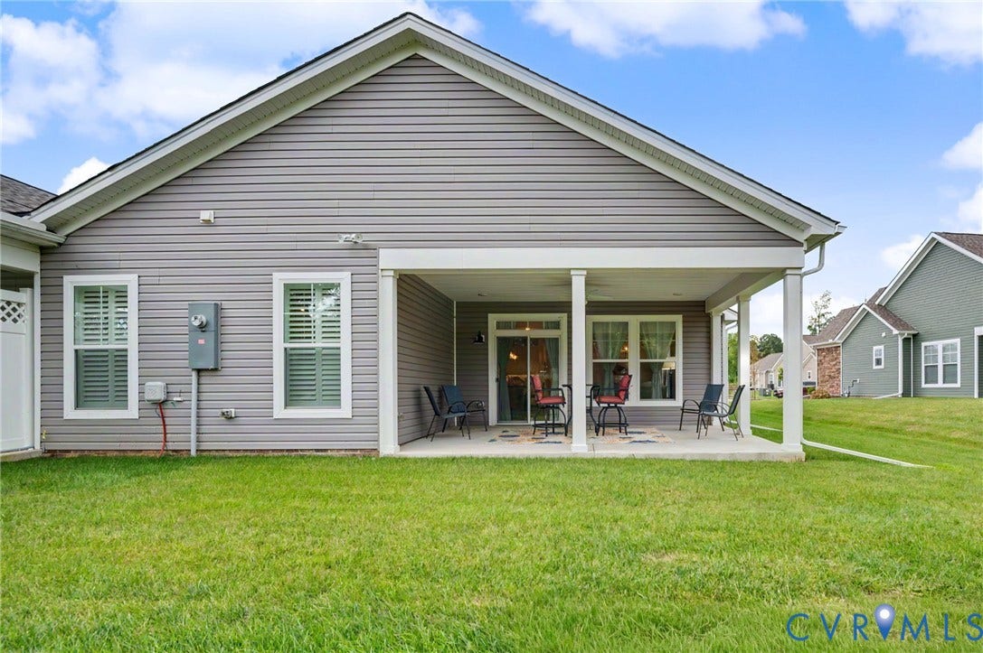 11618 Orchard Falls Circle, Chickahominy Falls, Glen Allen, VA 23059 Expansive backyard with a covered patio, featuring white support columns and a concrete surface