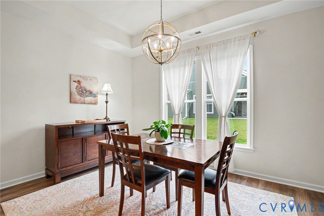 11618 Orchard Falls Circle, Chickahominy Falls, Glen Allen, VA 23059 Tray ceiling with a central spherical chandelier, wood-finish flooring, and multiple windows