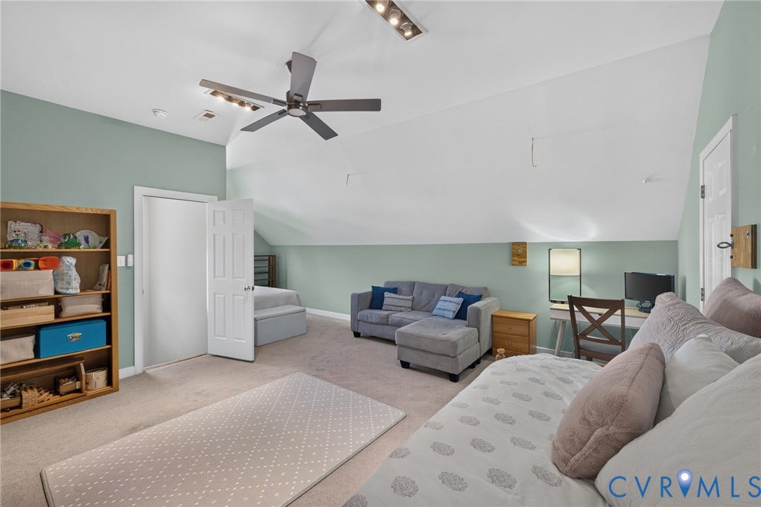 12320 Bradford Landing Way, Glen Allen, VA 23059 Vaulted ceilings with recessed lighting and a ceiling fan define this carpeted room