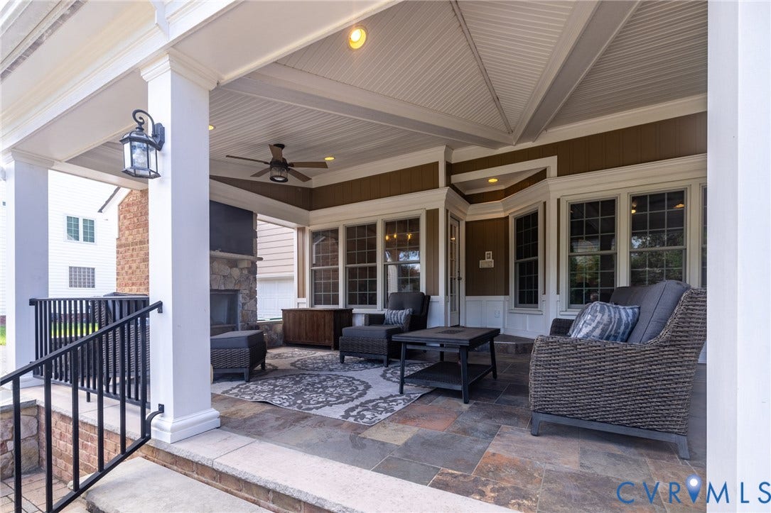 12320 Bradford Landing Way, Glen Allen, VA 23059 Covered patio featuring a stone fireplace, ceiling fan, recessed lighting, and slate-finish flooring