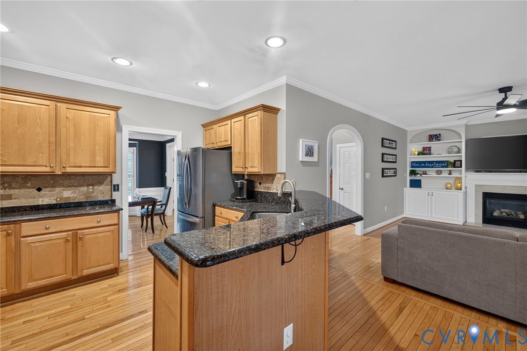 12320 Bradford Landing Way, Glen Allen, VA 23059 Open-concept kitchen and living area featuring wood-finish flooring, recessed lighting, and crown molding