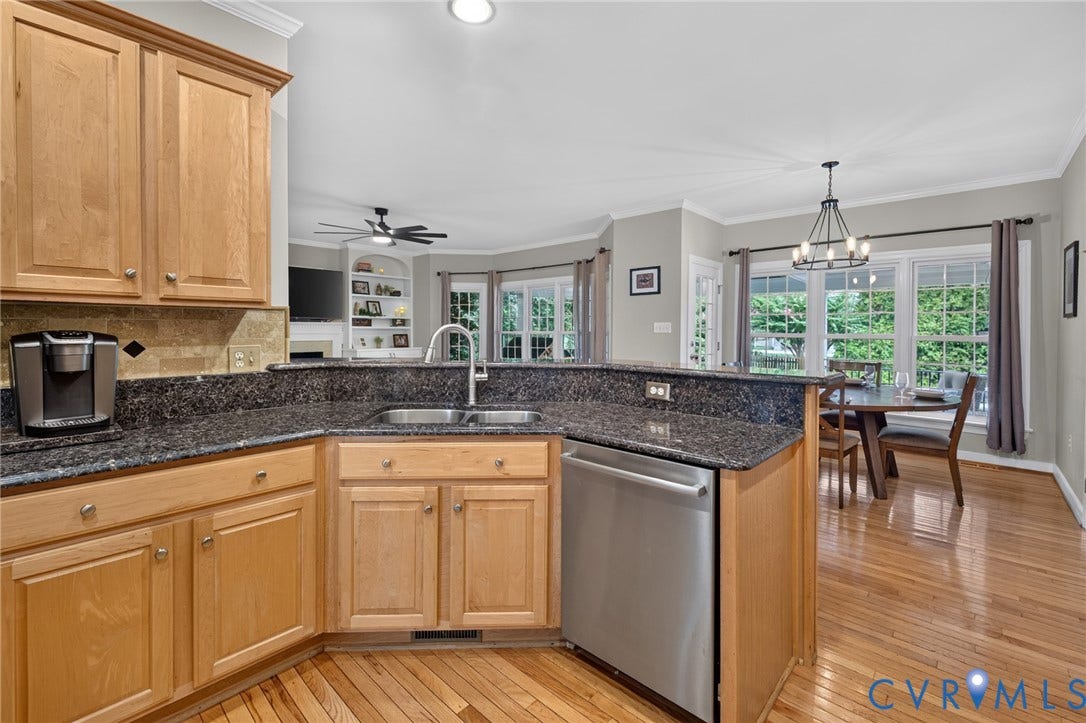 12320 Bradford Landing Way, Glen Allen, VA 23059 Kitchen featuring granite countertops, wood cabinetry, stainless steel dishwasher, and hardwood flooring