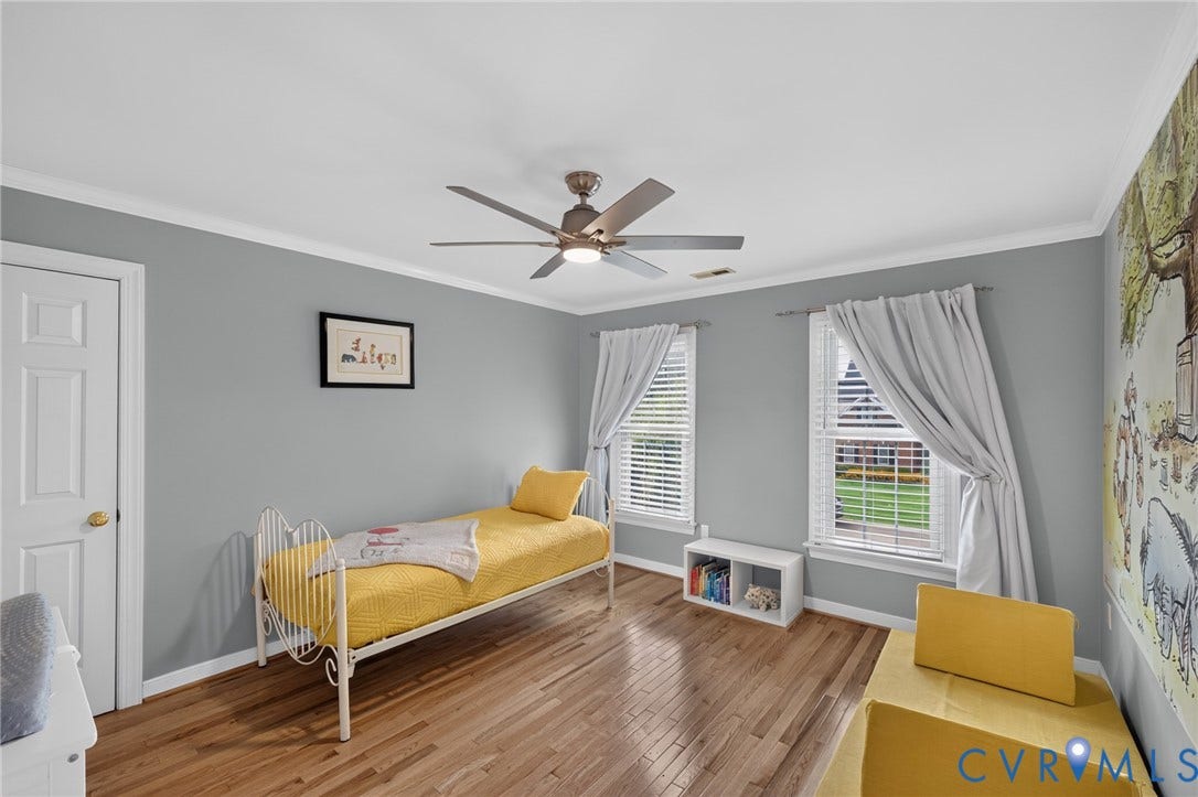 12320 Bradford Landing Way, Glen Allen, VA 23059 Hardwood-style flooring throughout this room with crown molding and ceiling fan