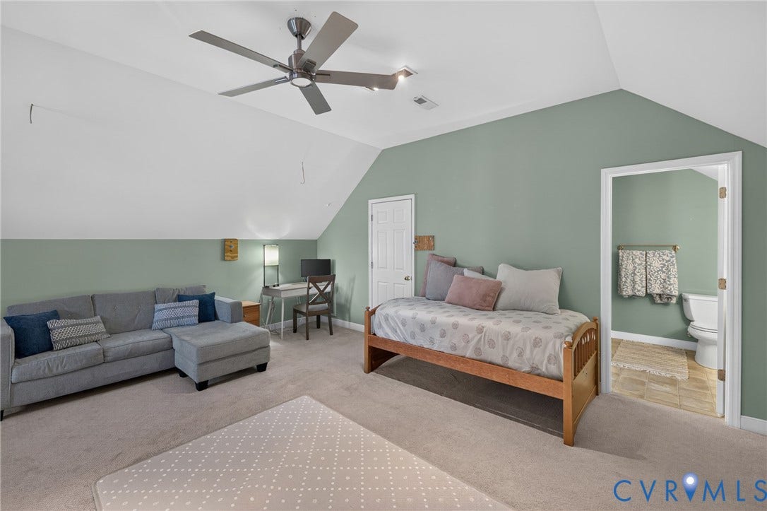 12320 Bradford Landing Way, Glen Allen, VA 23059 Carpeted room featuring a ceiling fan, a private bathroom with tile flooring, and a door leading to another area