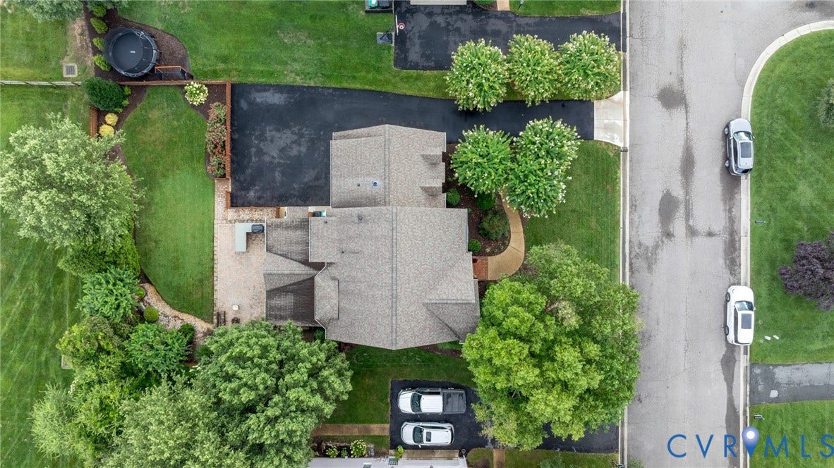 12320 Bradford Landing Way, Glen Allen, VA 23059 Expansive property featuring a multi-level roofline, asphalt driveway, and a curved stone pathway