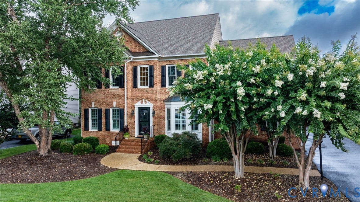 12320 Bradford Landing Way, Glen Allen, VA 23059 Traditional brick-front residence featuring a prominent bay window and contrasting black shutters