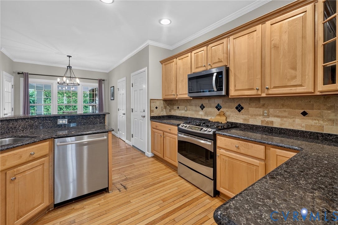 12320 Bradford Landing Way, Glen Allen, VA 23059 Kitchen featuring wood-finish flooring, light wood cabinetry, and dark speckled countertops