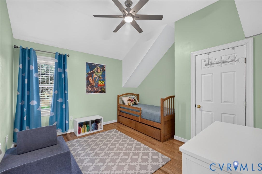 12320 Bradford Landing Way, Glen Allen, VA 23059 Bedroom featuring light green walls, a sloped ceiling, and wood-finish flooring