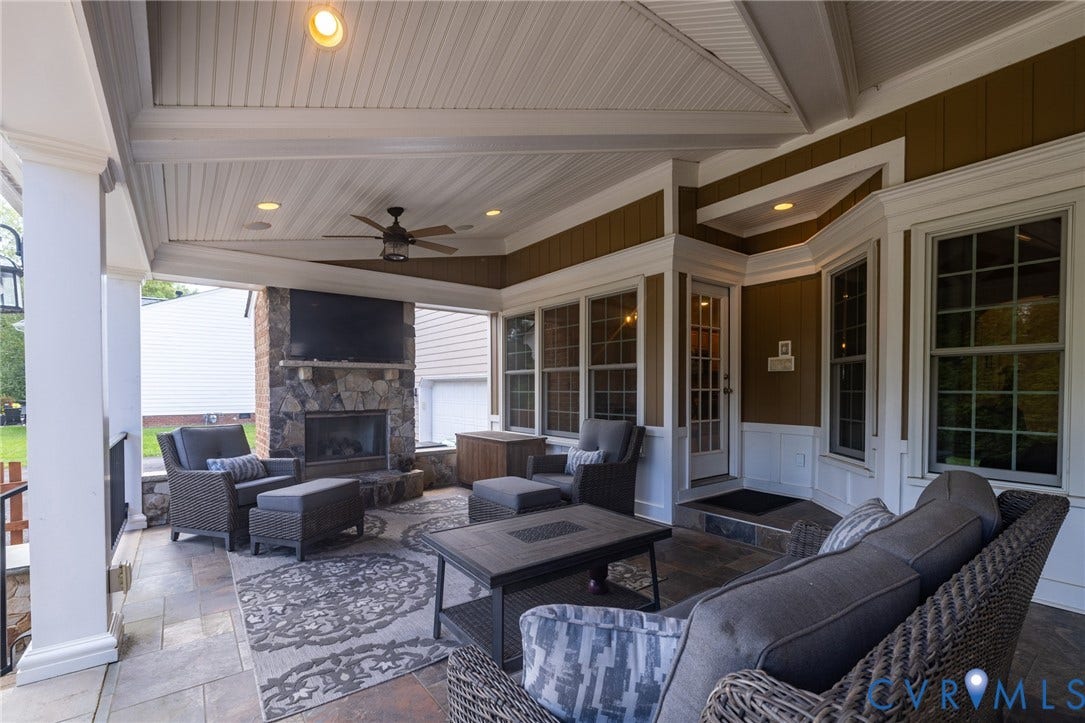 12320 Bradford Landing Way, Glen Allen, VA 23059 Covered outdoor patio featuring a stone-clad fireplace, recessed lighting, a ceiling fan, and tiled flooring