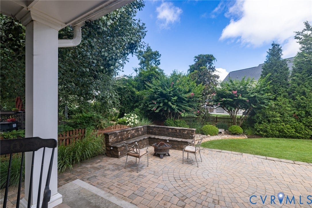 12320 Bradford Landing Way, Glen Allen, VA 23059 Expansive paver patio with a circular pattern and built-in stone seating