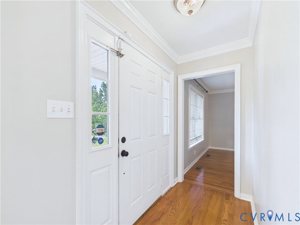 4515 Exton Lane, Chester, VA 23831 Entryway featuring hardwood flooring, crown molding, a paneled door with a sidelight, and a ceiling-mounted light fixture