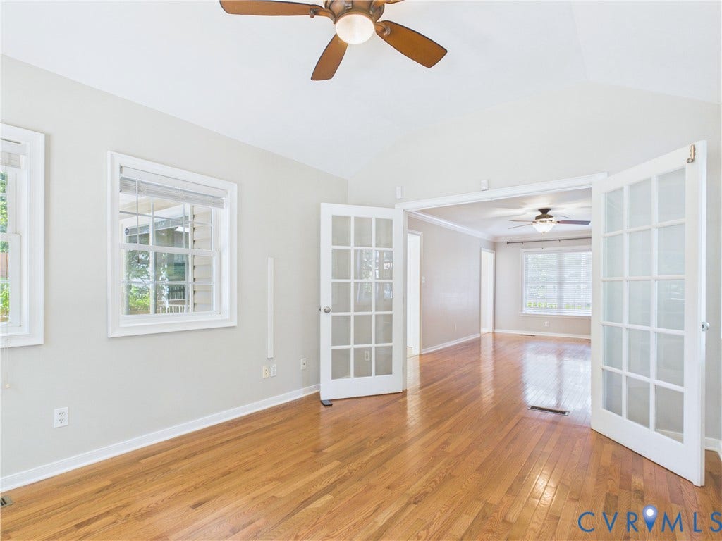 4515 Exton Lane, Chester, VA 23831 FL Room-Vaulted ceiling with a ceiling fan, wood-finish flooring, white walls, and white-framed windows, with a set of white French doors