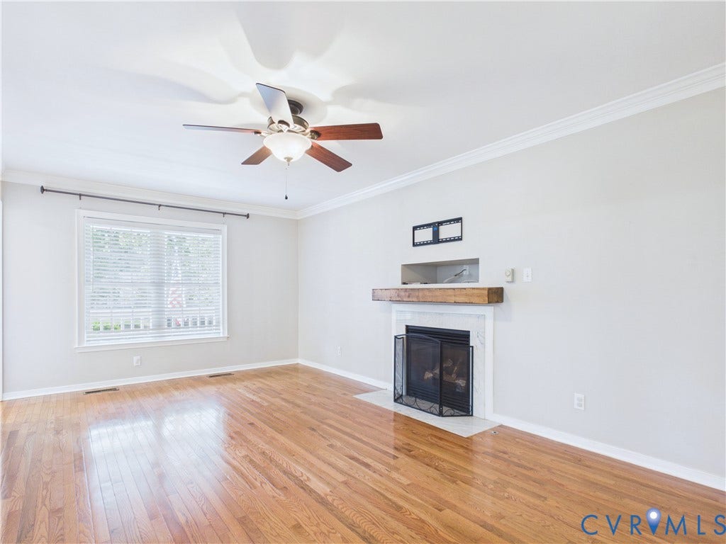 4515 Exton Lane, Chester, VA 23831 Hardwood flooring throughout, featuring a fireplace with a wood mantel