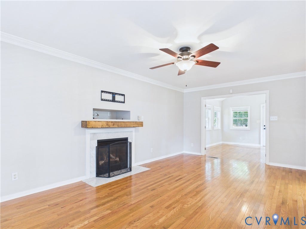 4515 Exton Lane, Chester, VA 23831 Hardwood flooring, crown molding, ceiling fan with integrated lighting, built-in fireplace with a hearth, and a wood mantel