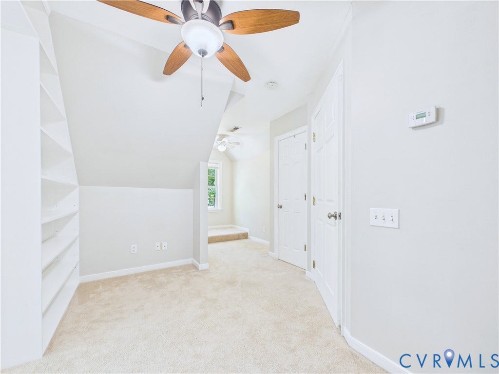 4515 Exton Lane, Chester, VA 23831 Built-in shelving, carpeted flooring, ceiling fan with light fixture, and white painted walls