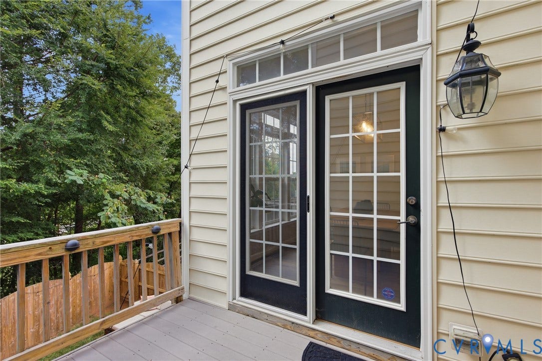 Outdoor deck with composite decking and wood railing