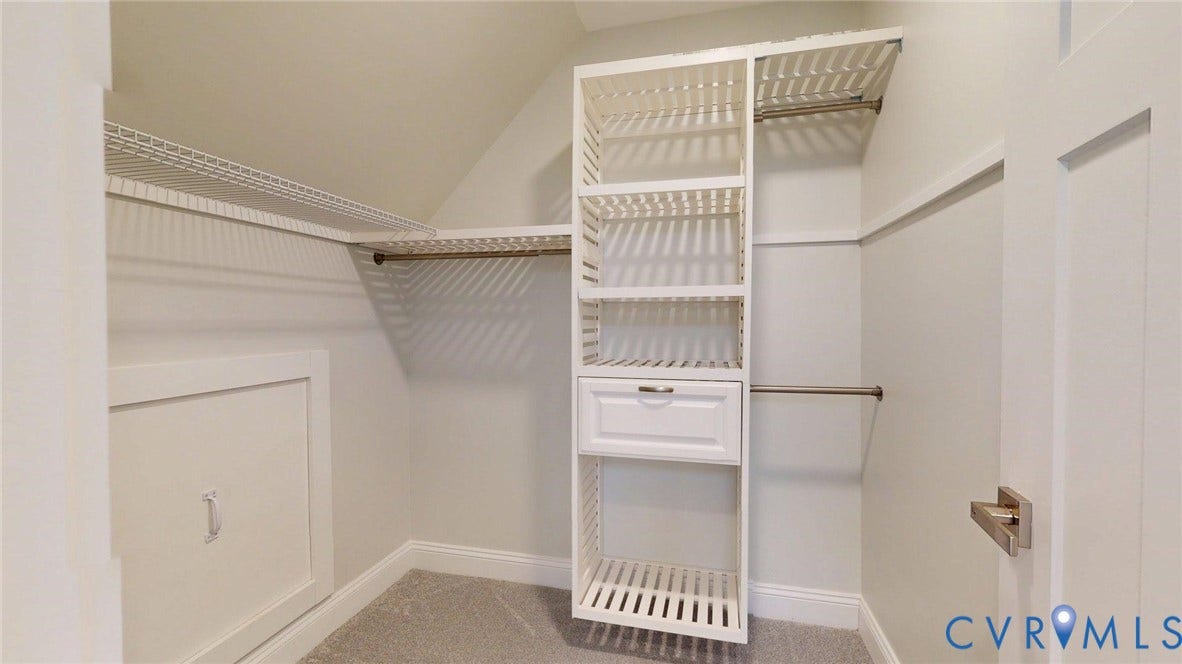 Built-in closet organization system featuring shelving and hanging rods