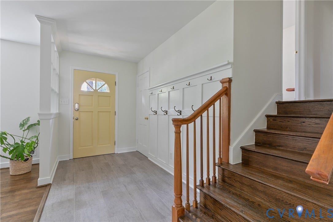 200 Stanmore Road, North Chesterfield, VA 23236 Wood-finish flooring, built-in coat rack, wooden staircase with railing, paneled entry door with transom window